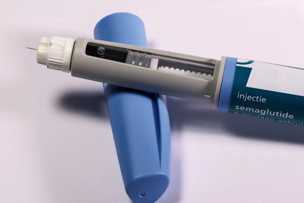 Close up of a semaglutide injection pen on a white surface.