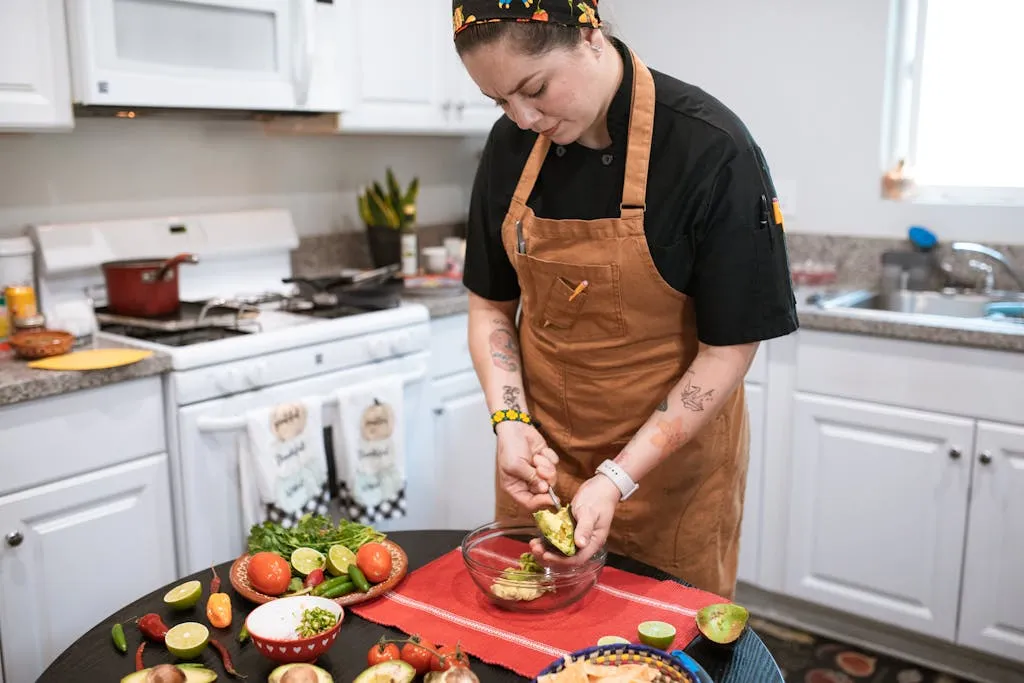 Person preparing a low-sodium meal in a bowl.