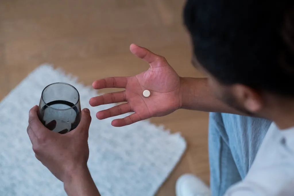Man taking a sulfonylurea pill.